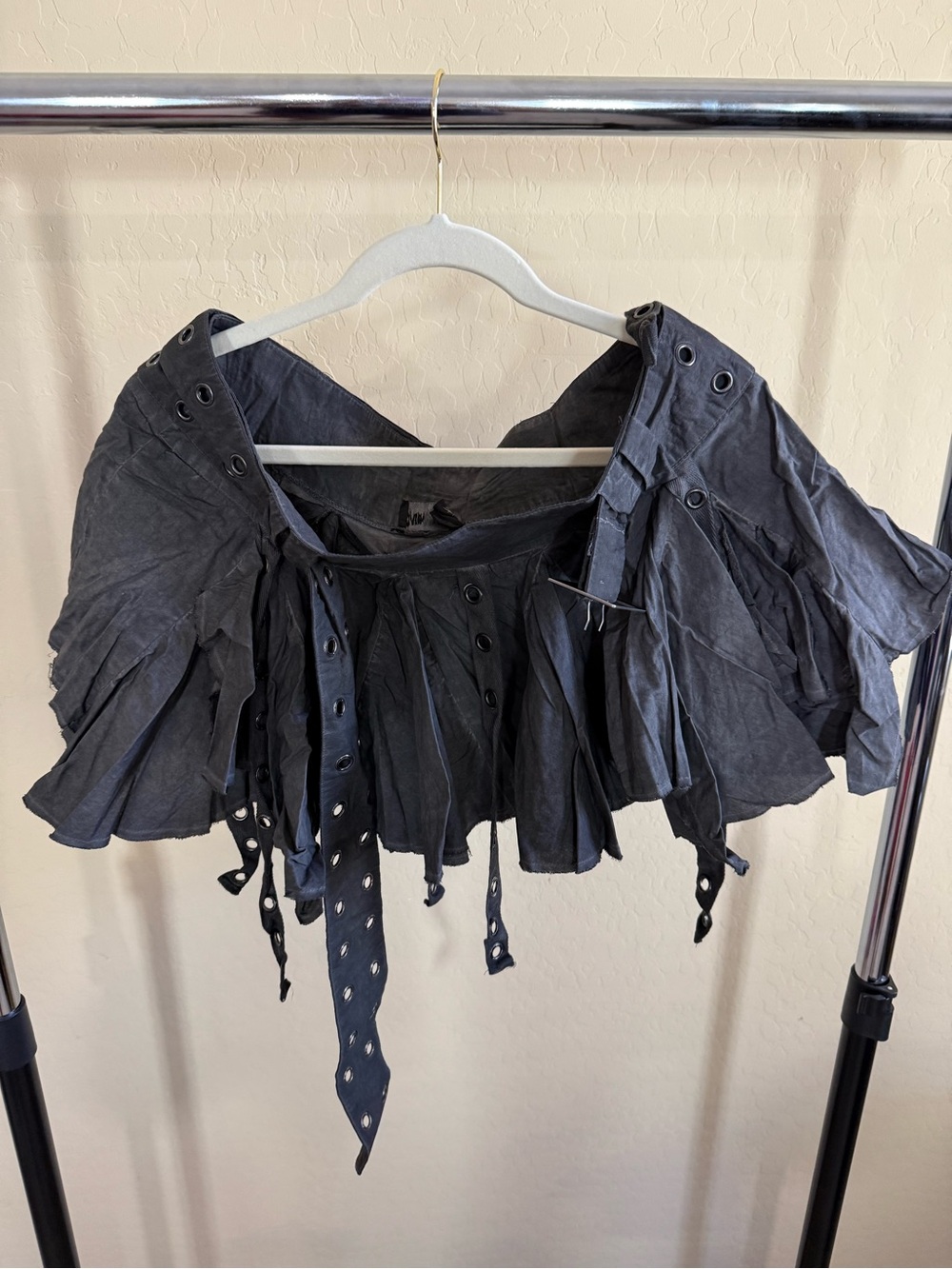 Black Mini Pleated Skirt with Eyelet Details